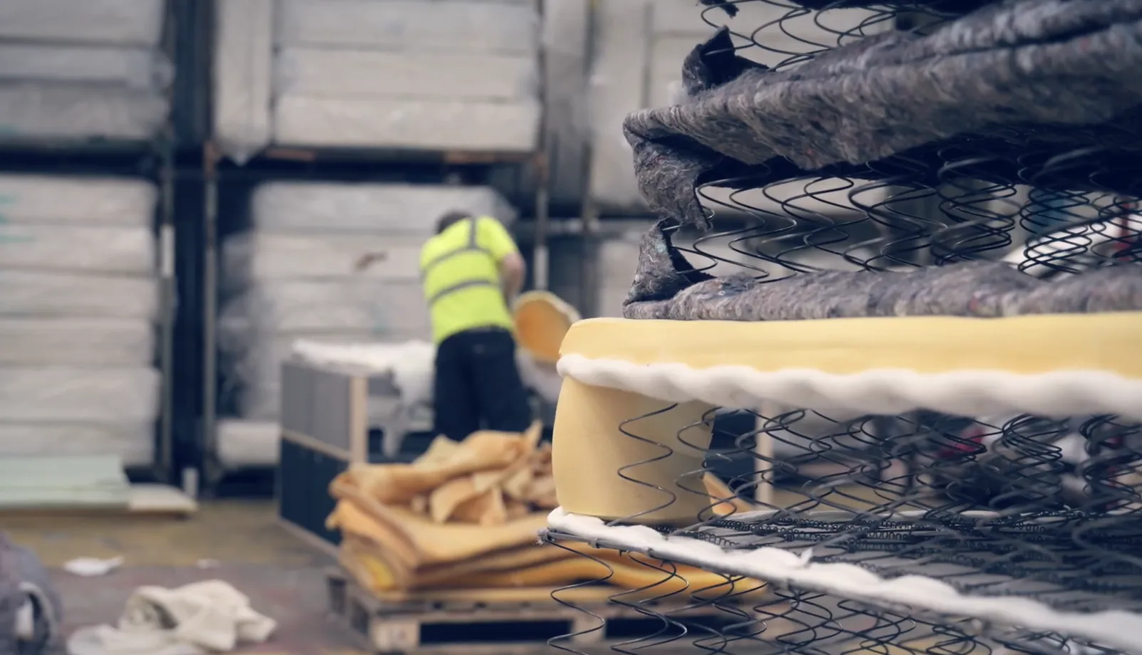 Mattress layers showing springs, foam and textile materials