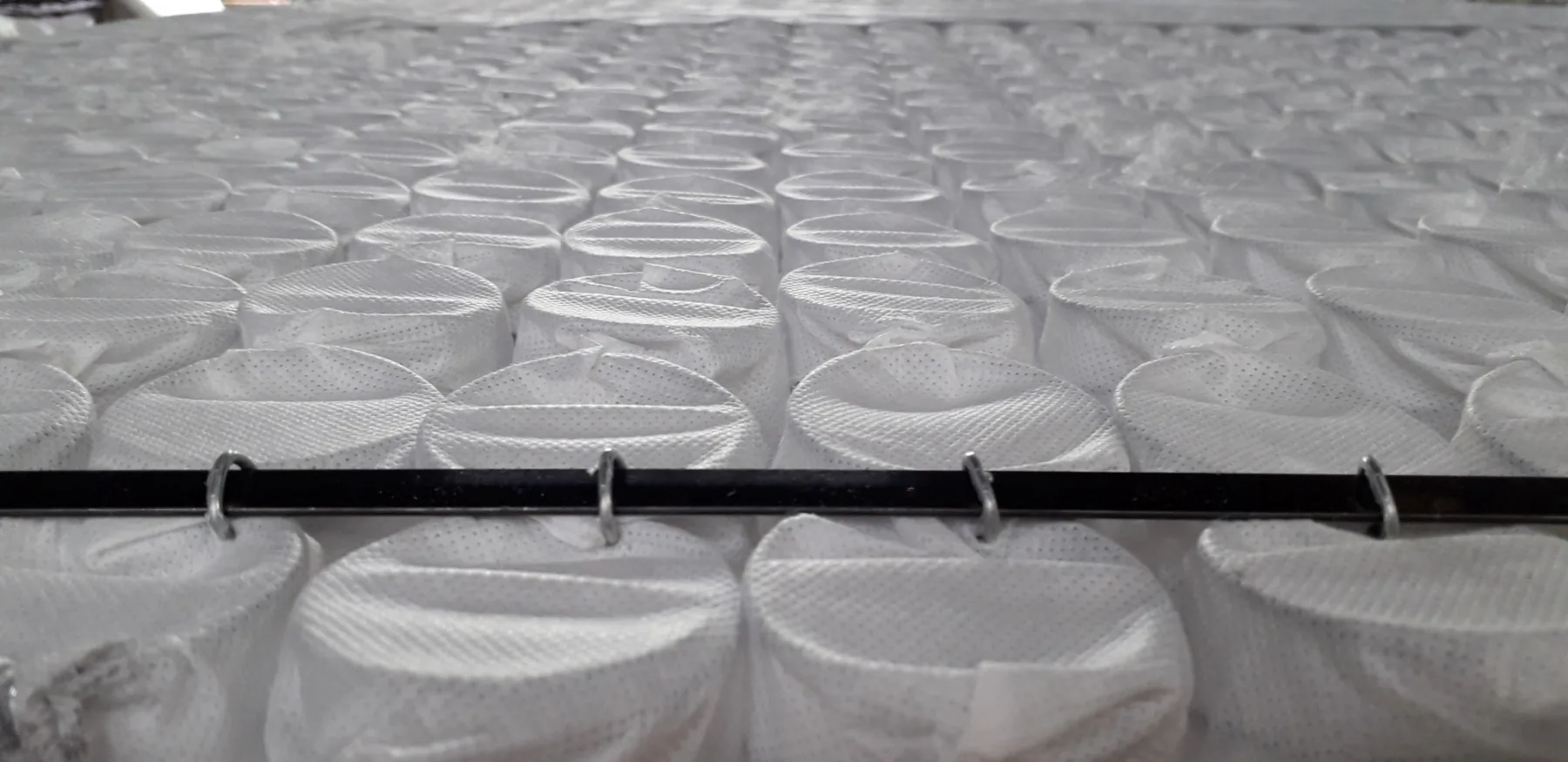 Mattress pocket springs and construction